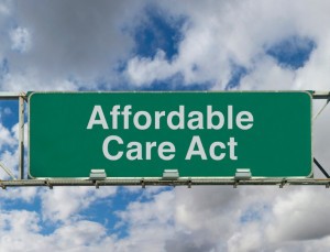 Picture of freeway sign  with phrase Affordable Care Act