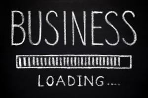 Picture of blackboard with phrase business loading written out