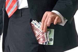 man showing foreign currency in pocket