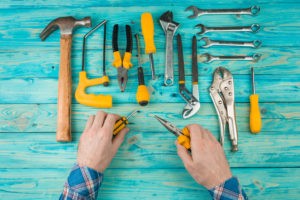 Picture of hand tools on a blue wooden table